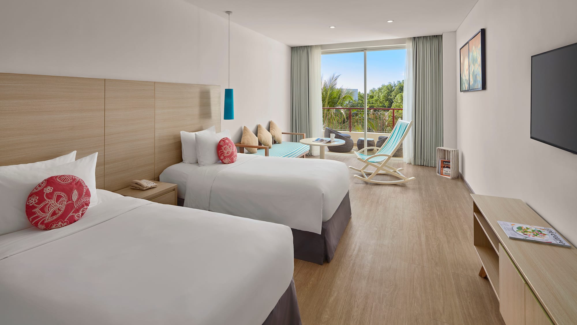 a room with two beds and a chair