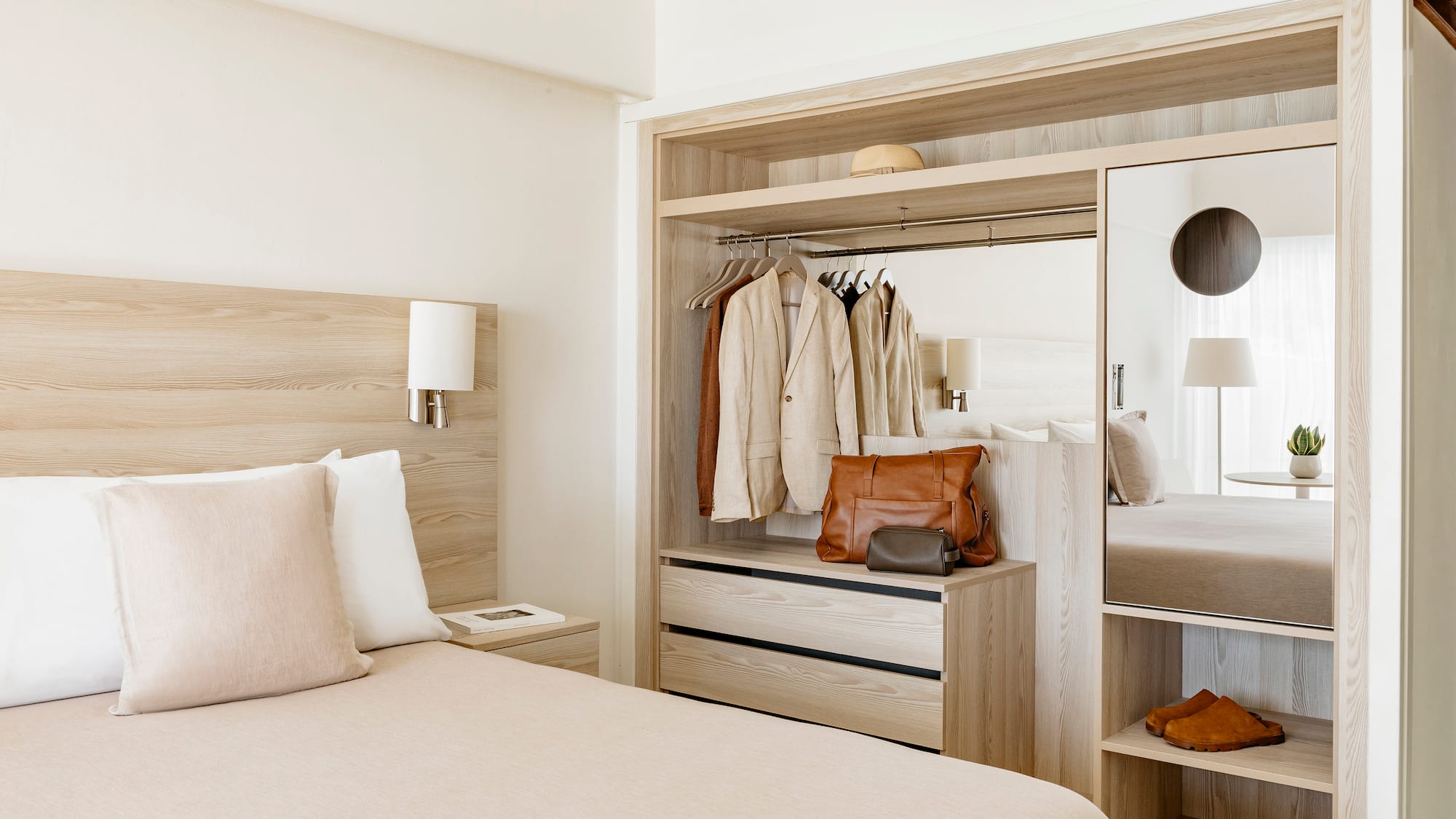 a room with a bed and a mirror