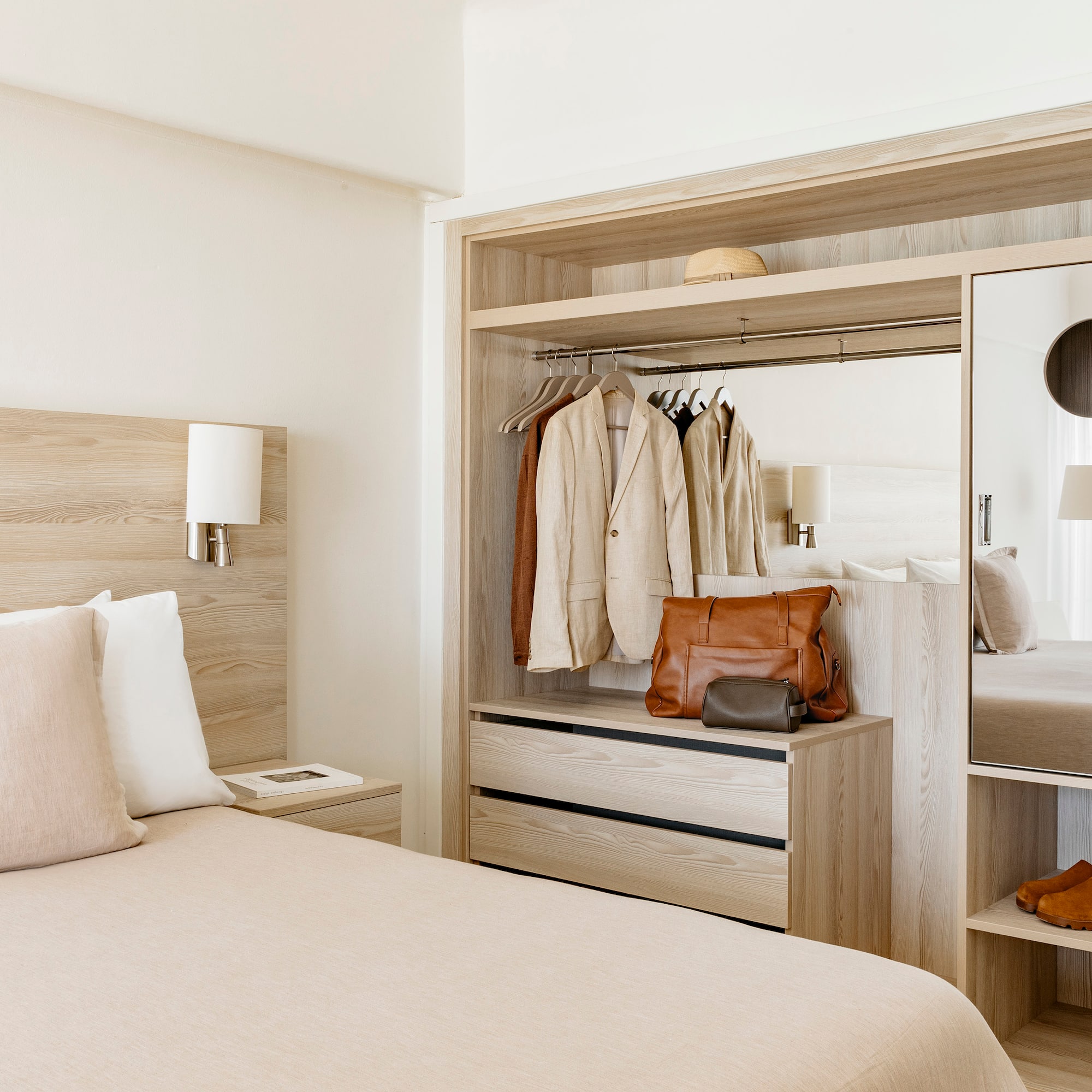 a room with a bed and a mirror