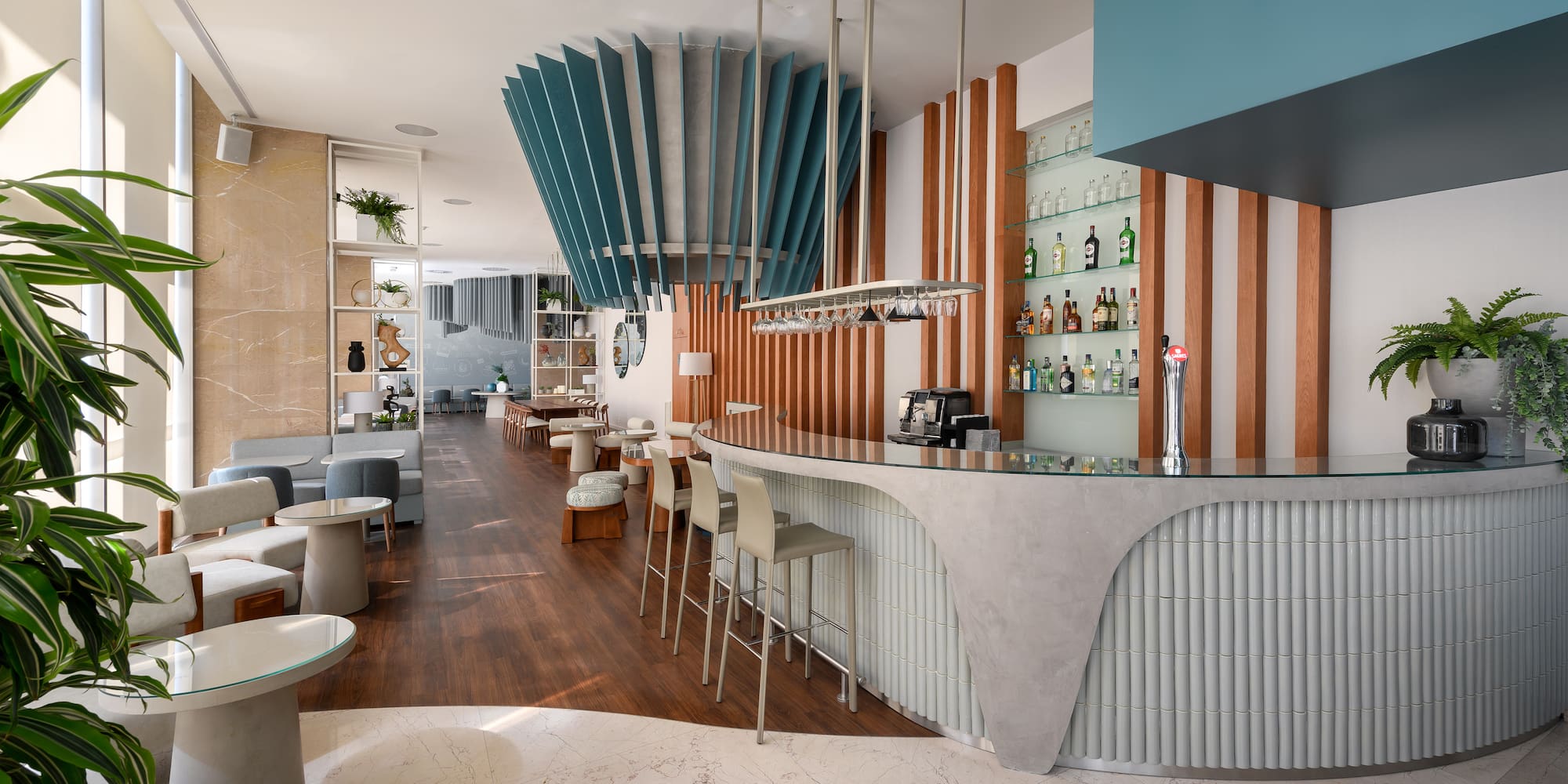 a bar with a counter and chairs