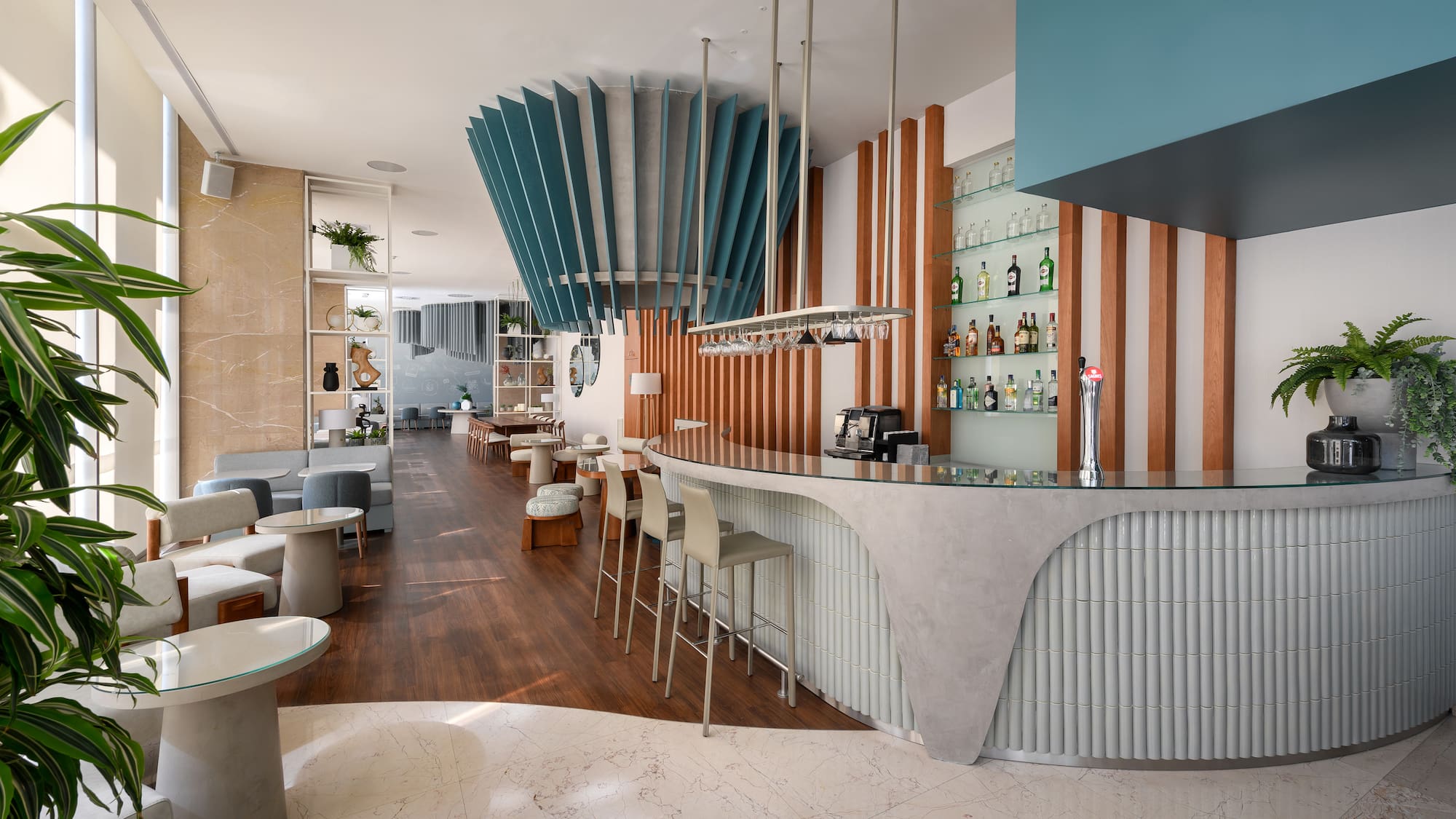 a bar with a counter and chairs
