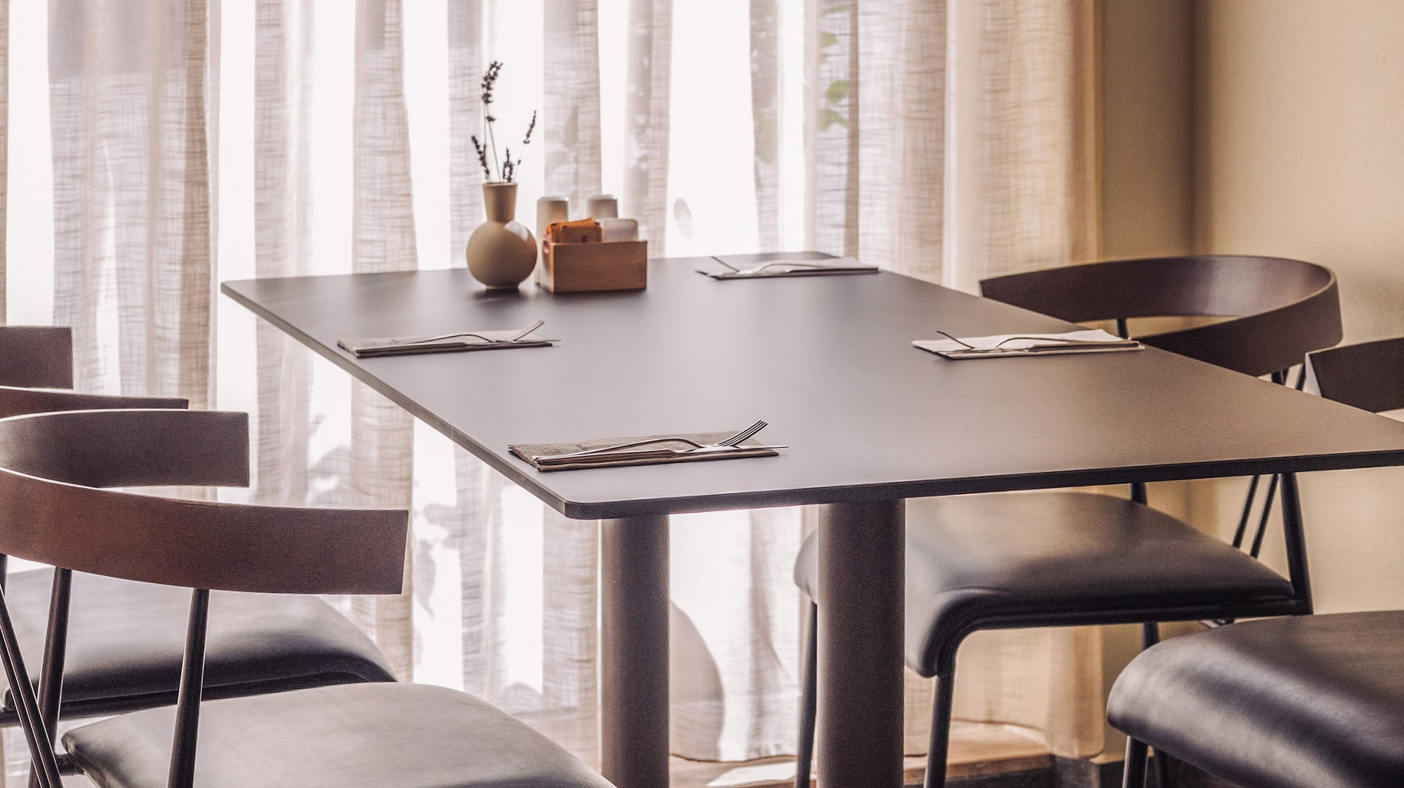 a table with chairs in a room