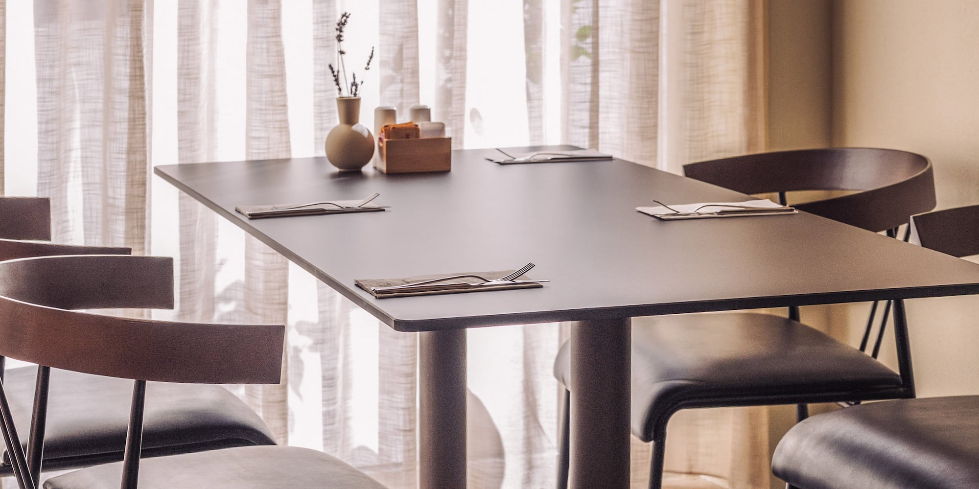 a table with chairs in a room