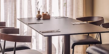 a table with chairs in a room