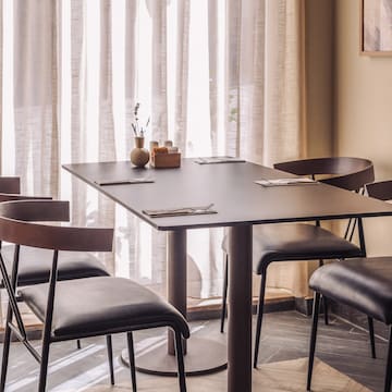 a table with chairs in a room