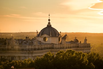 a building with a dome and trees