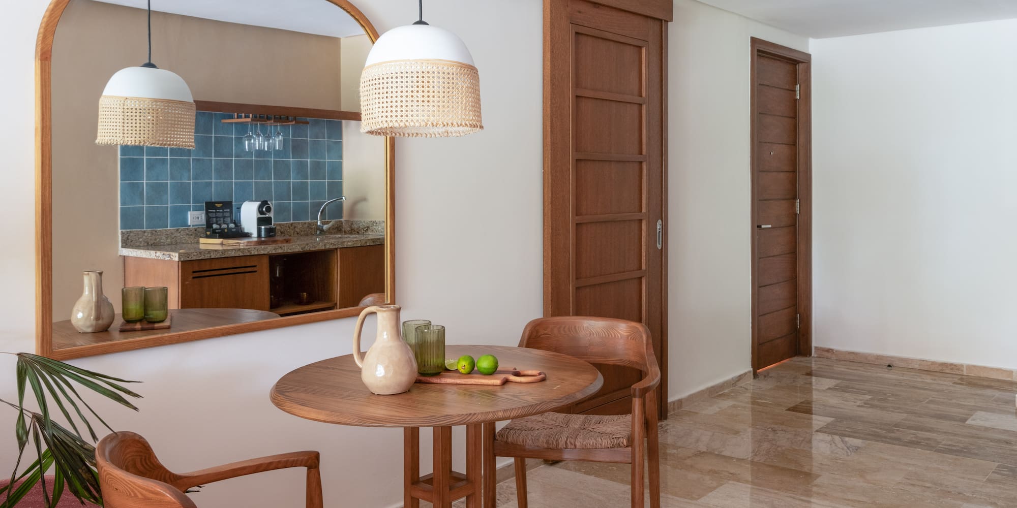 a dining room with a table and chairs