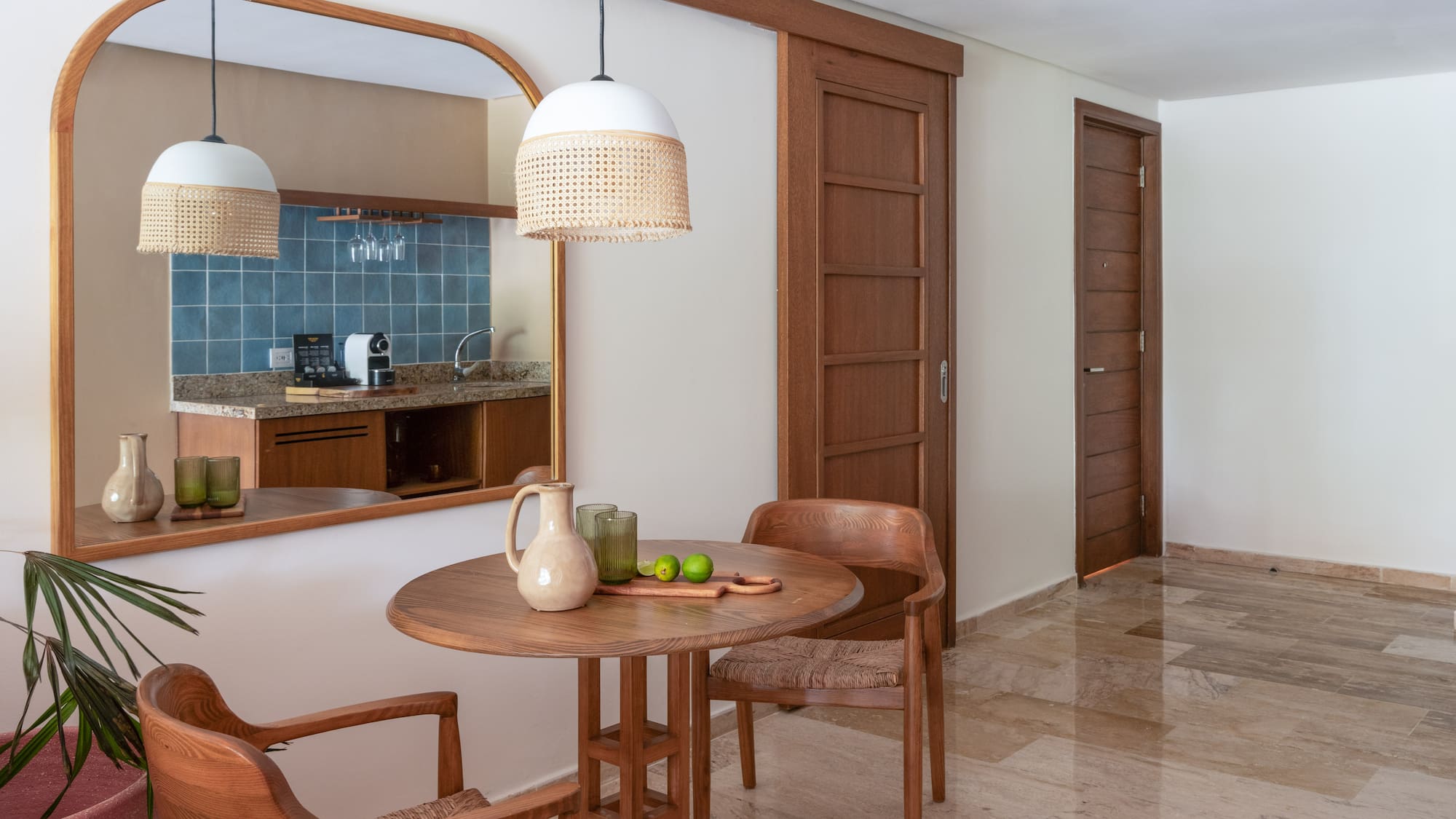 a dining room with a table and chairs