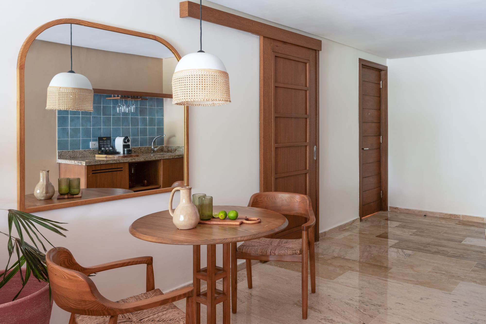 a dining room with a table and chairs