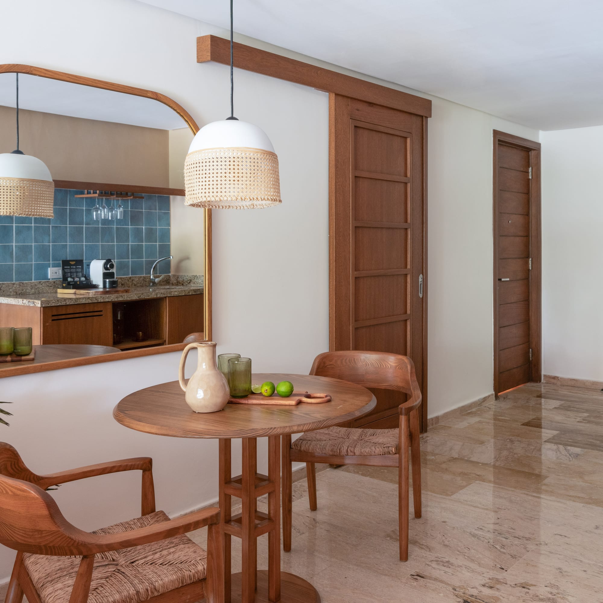 a dining room with a table and chairs