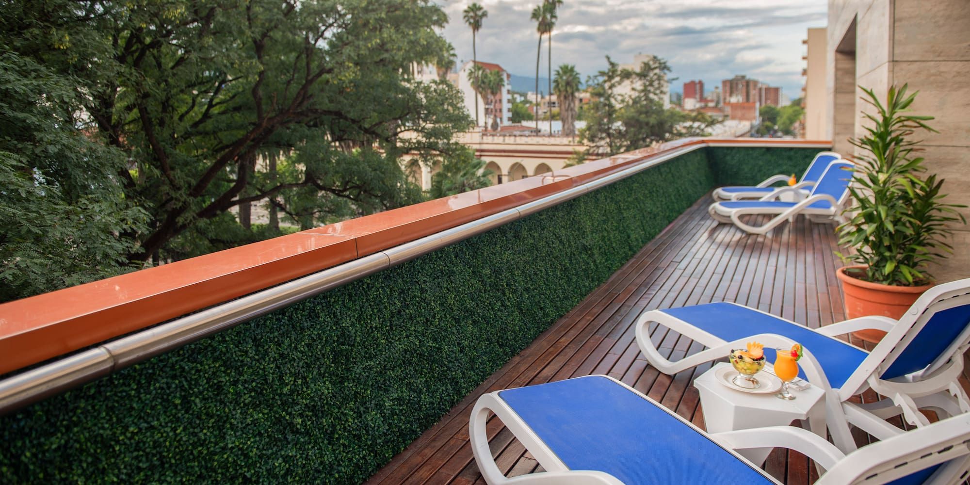 a deck with chairs and a table on it