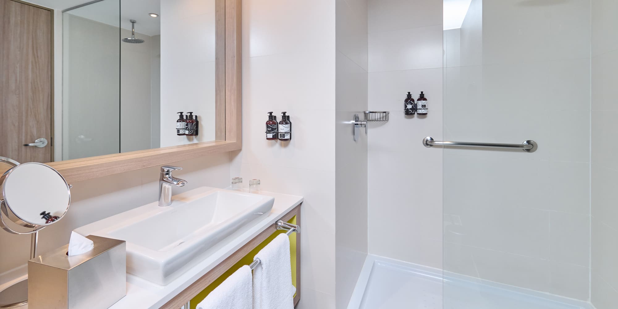 a bathroom with a shower and sink