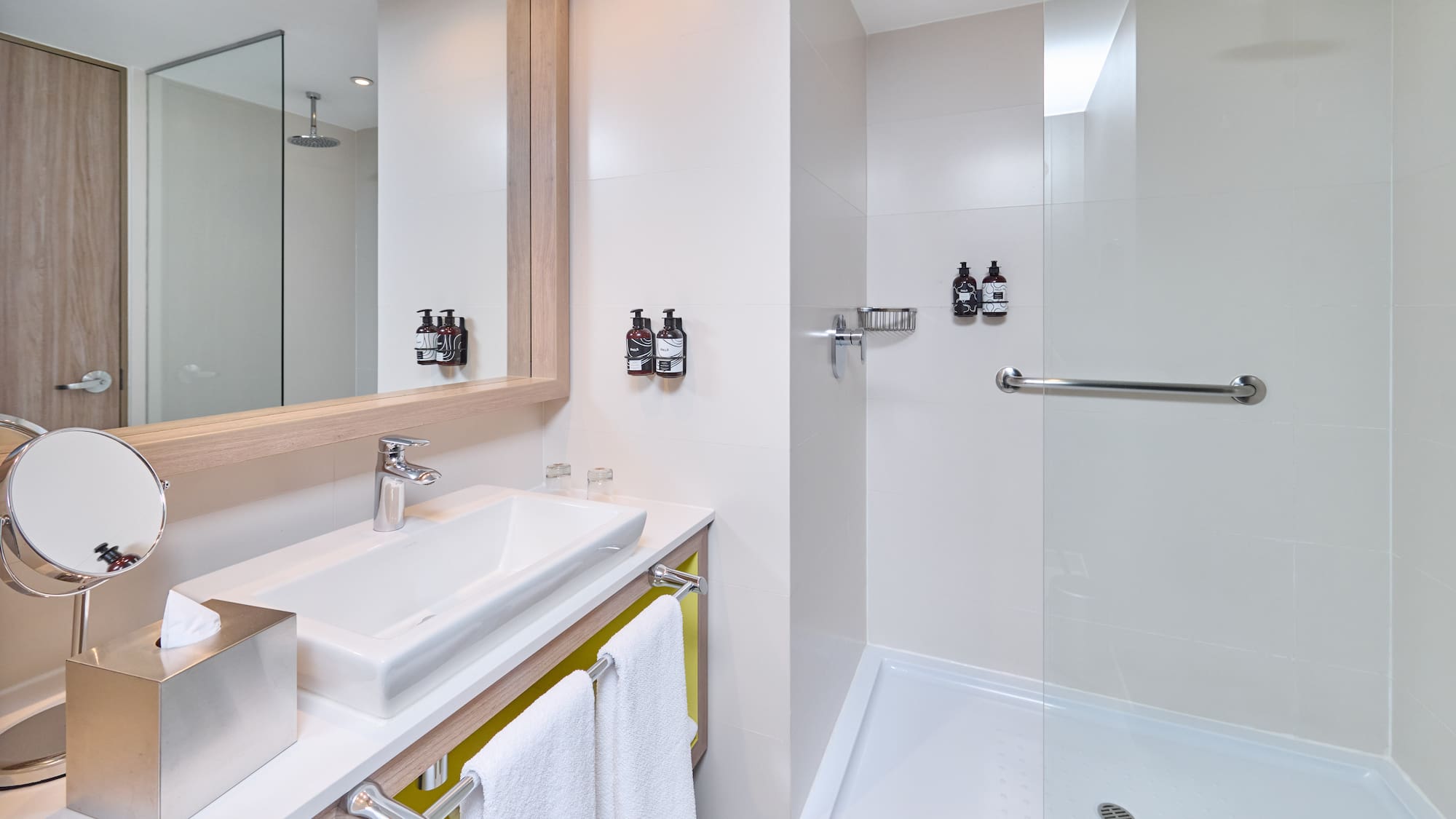 a bathroom with a shower and sink