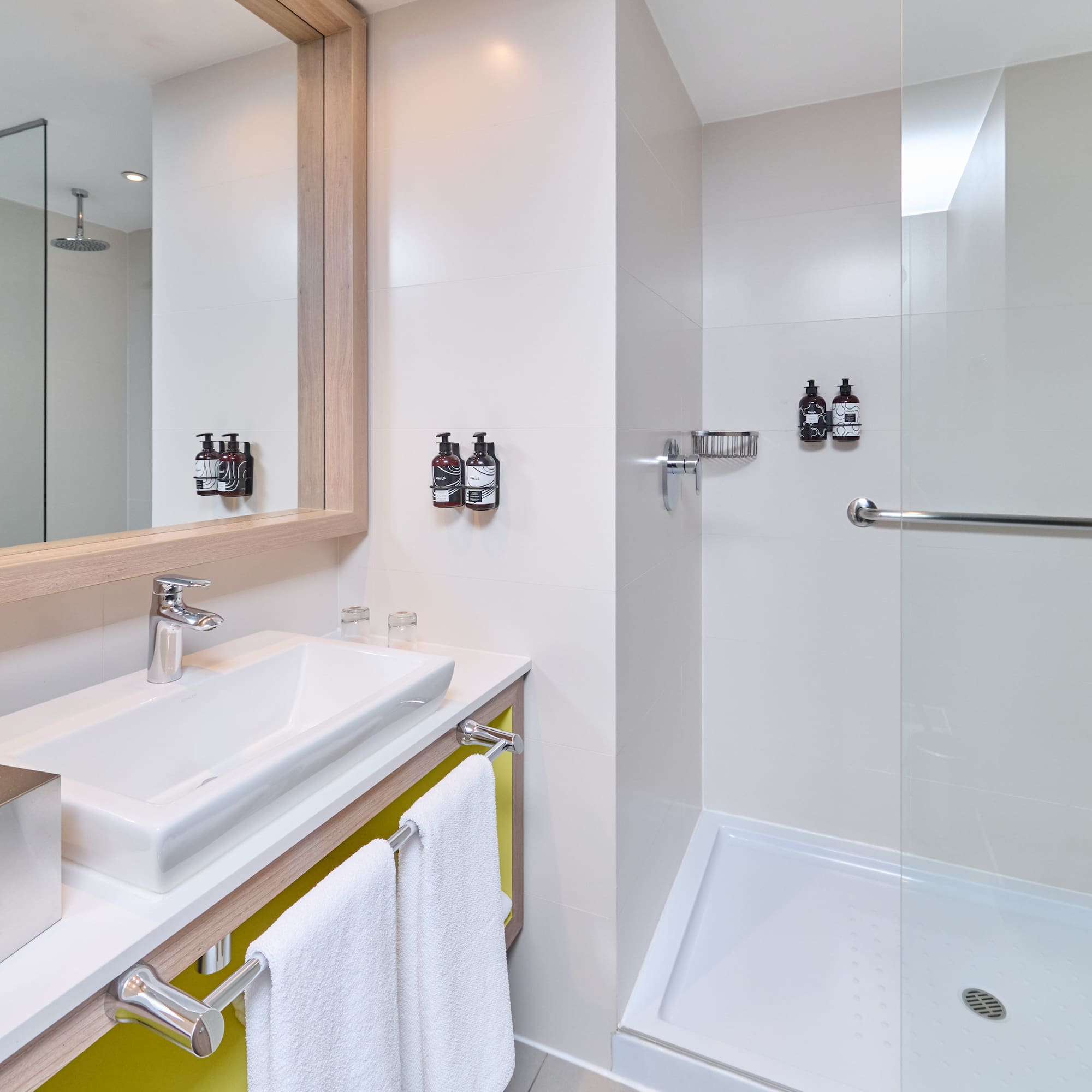 a bathroom with a shower and sink