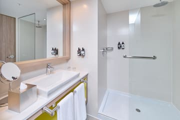 a bathroom with a shower and sink
