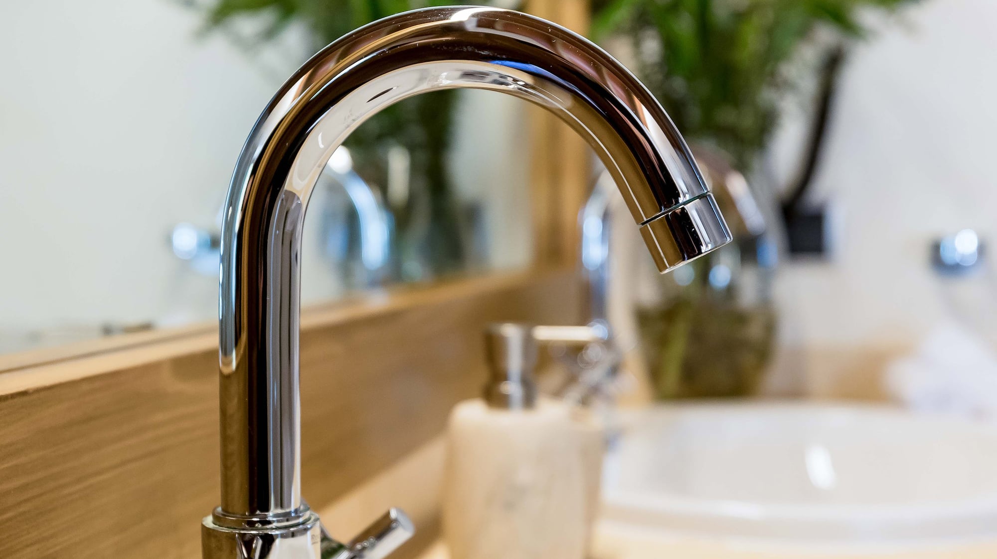 a faucet and sink in a bathroom
