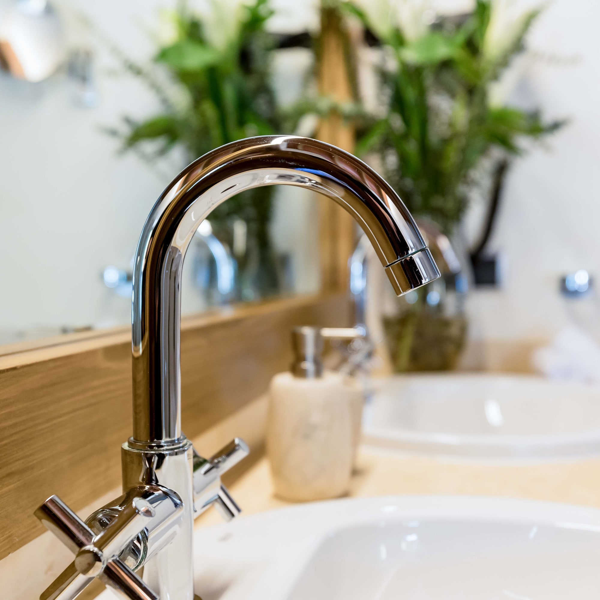 a faucet and sink in a bathroom