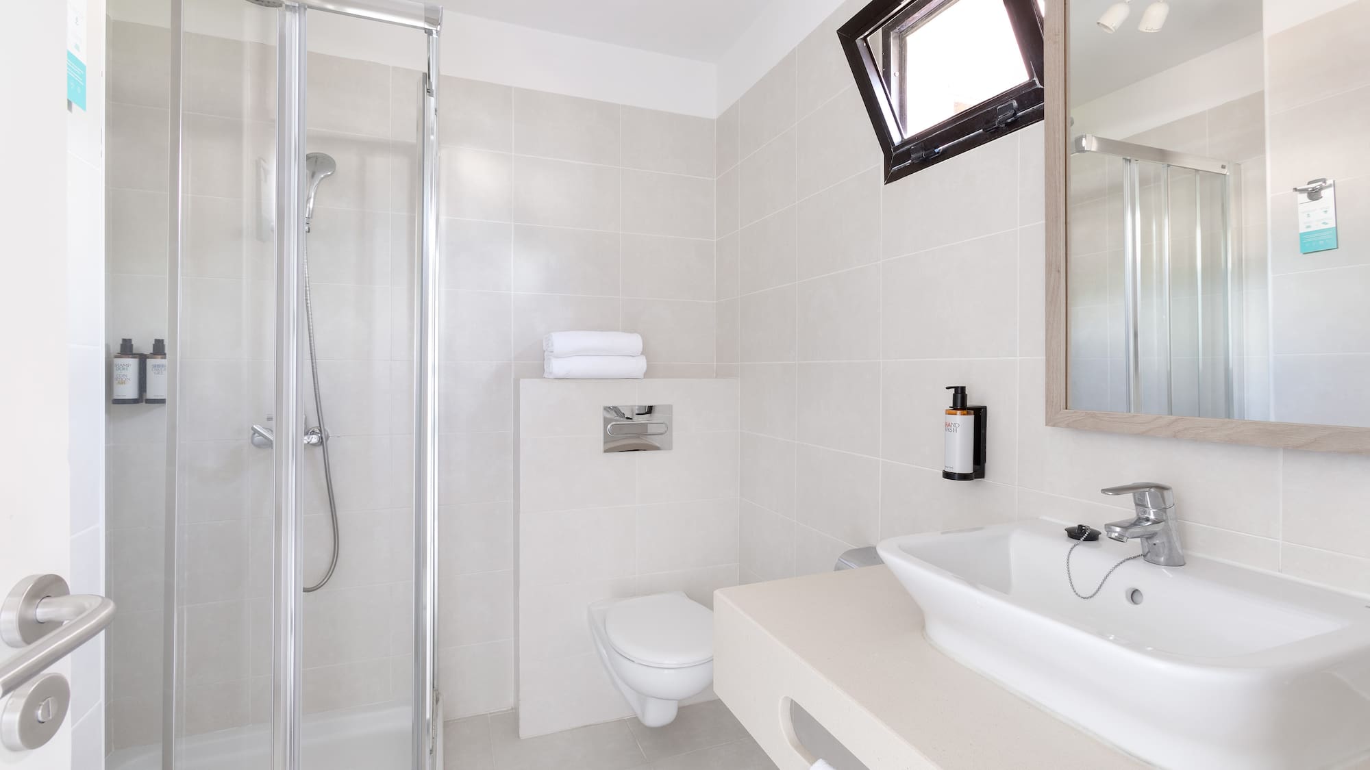 a bathroom with a shower and sink