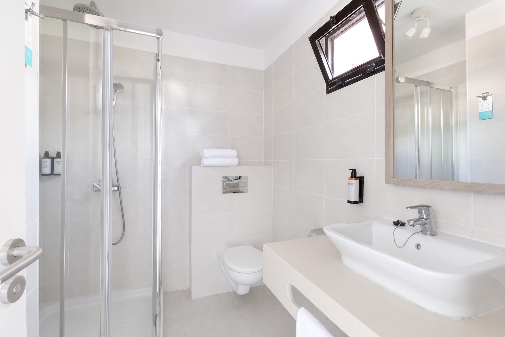 a bathroom with a shower and sink