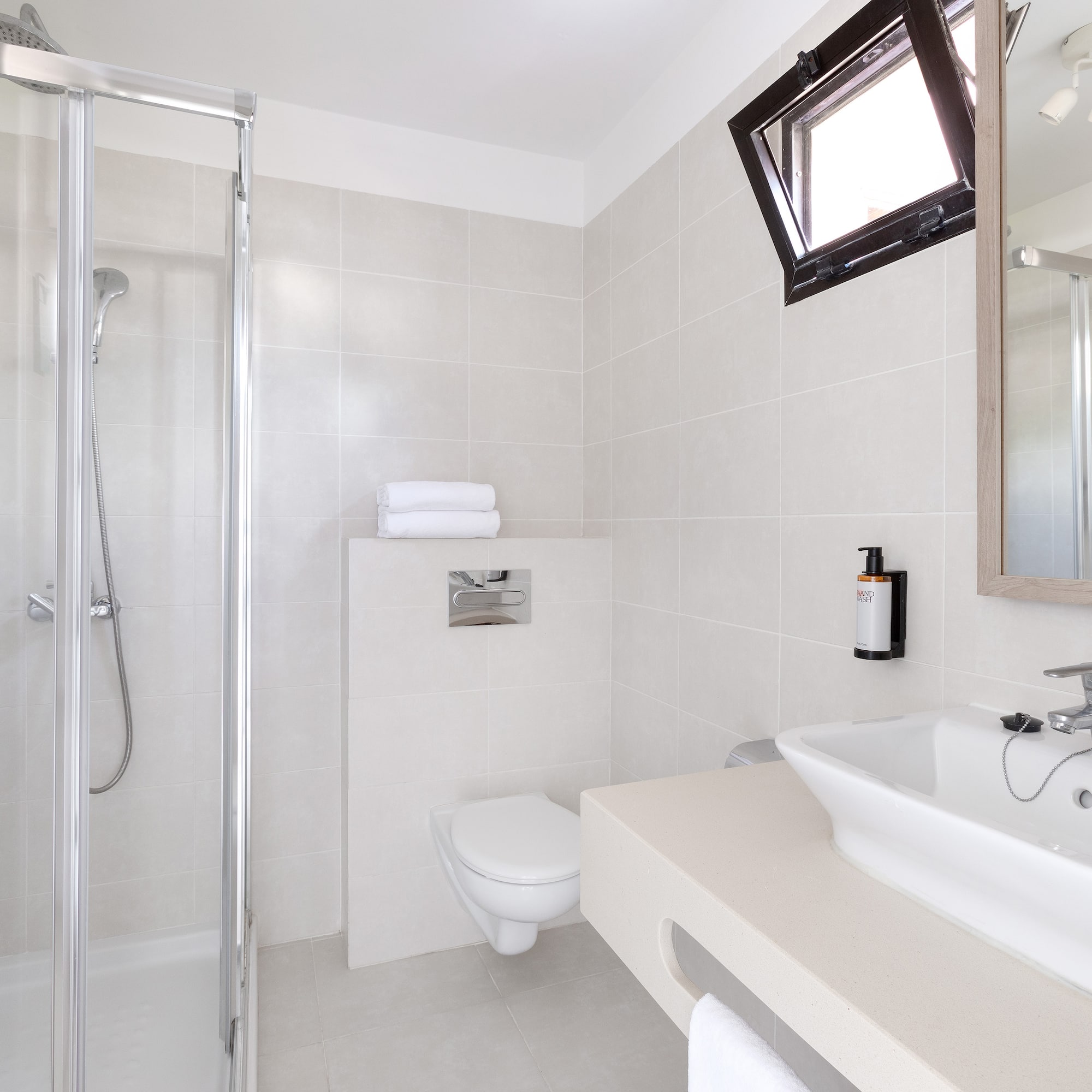 a bathroom with a shower and sink