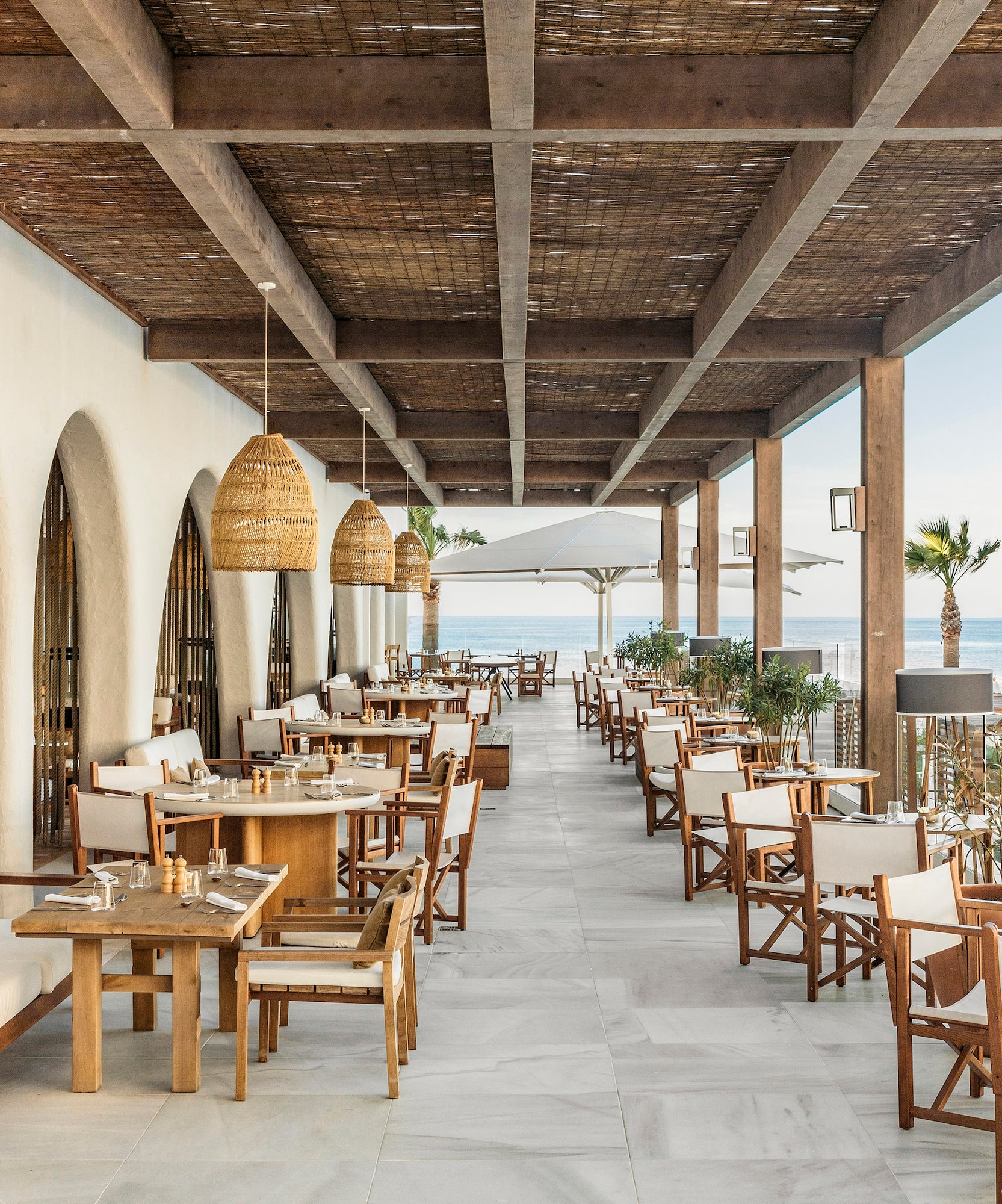 a restaurant with tables and chairs on a patio