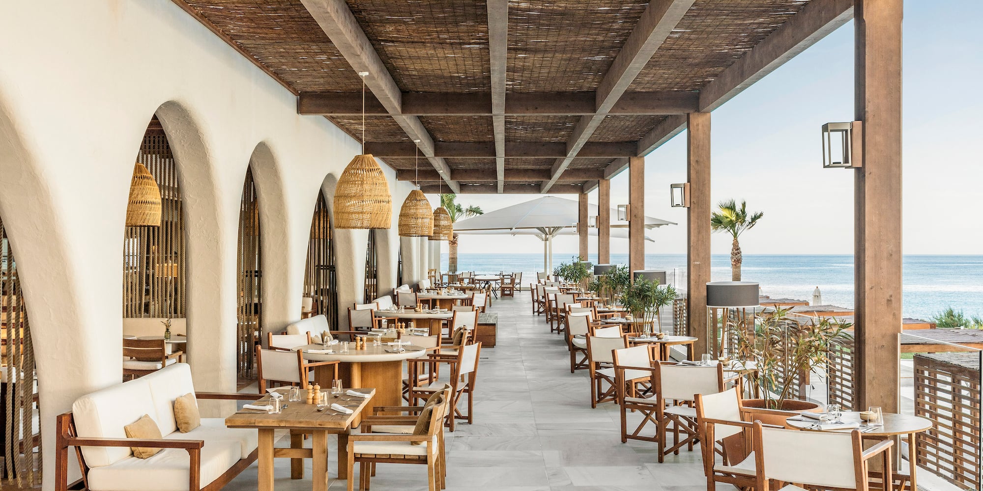 a restaurant with tables and chairs on a patio
