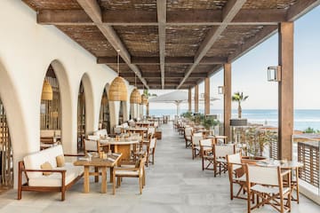 a restaurant with tables and chairs on a patio