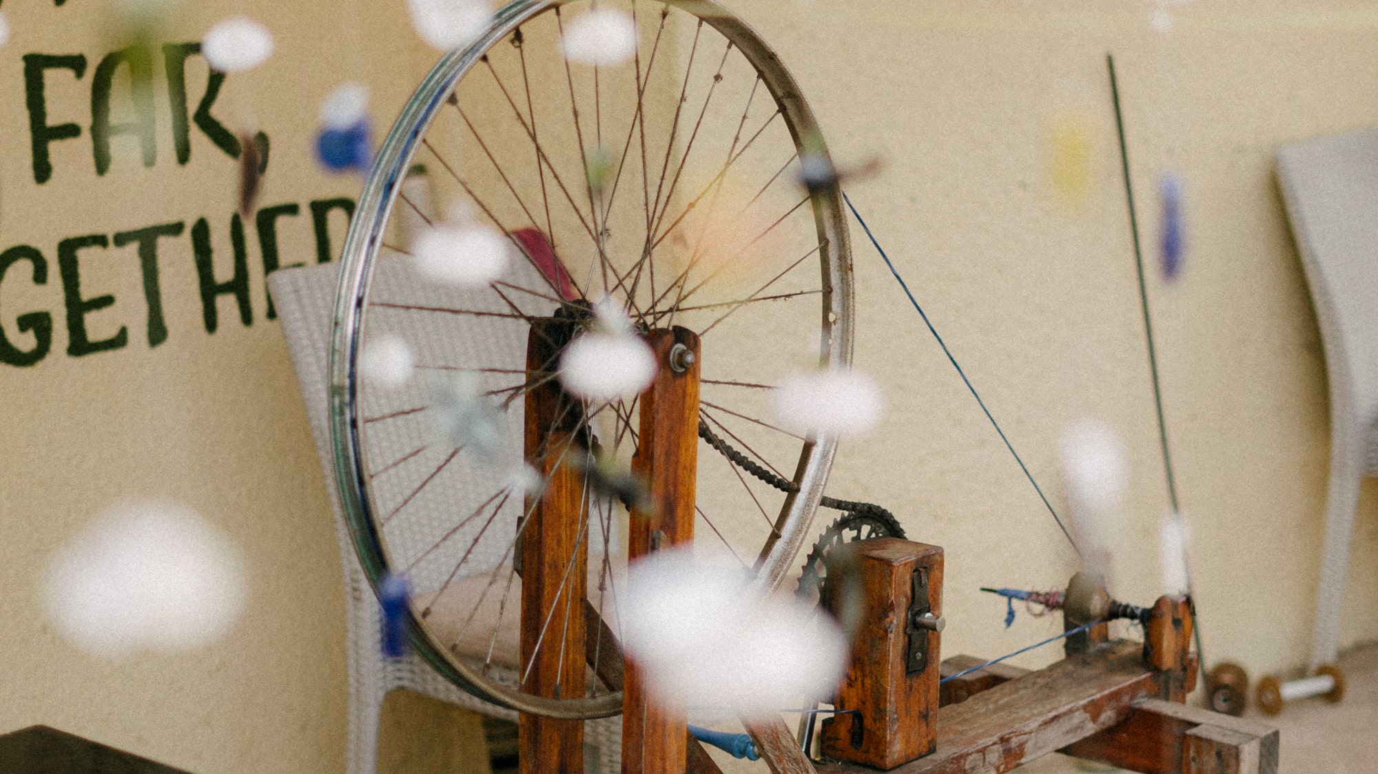 a bicycle wheel on a wooden stand