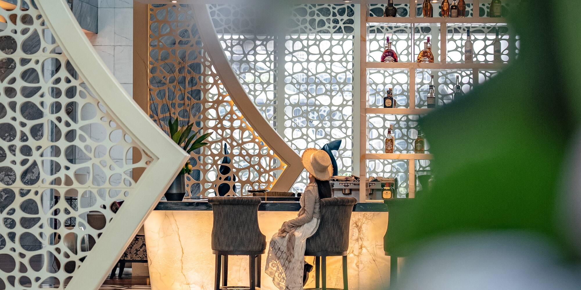 a woman sitting at a bar