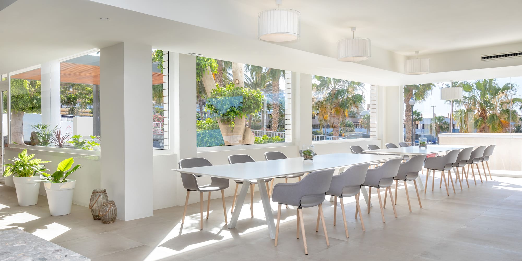 a room with a long table and chairs