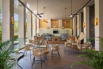 a room with chairs and tables