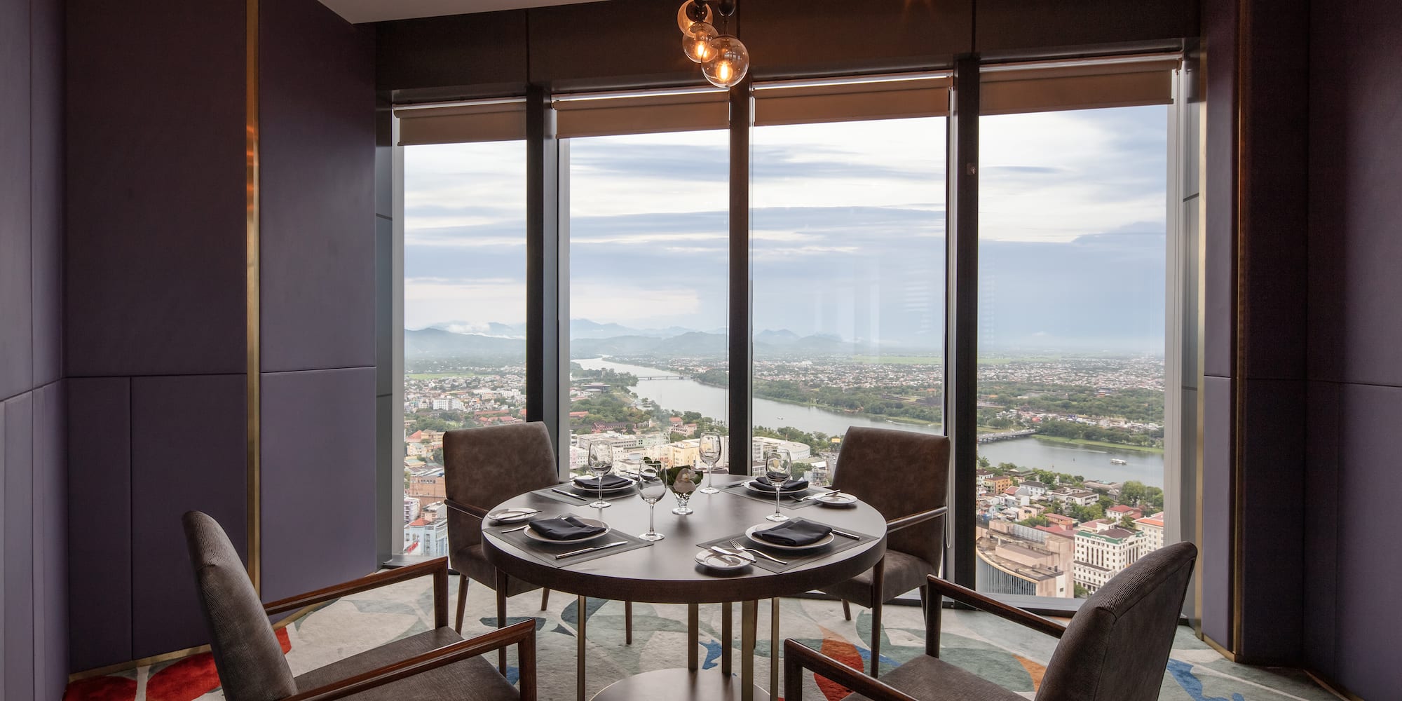 a dining room with a table and chairs