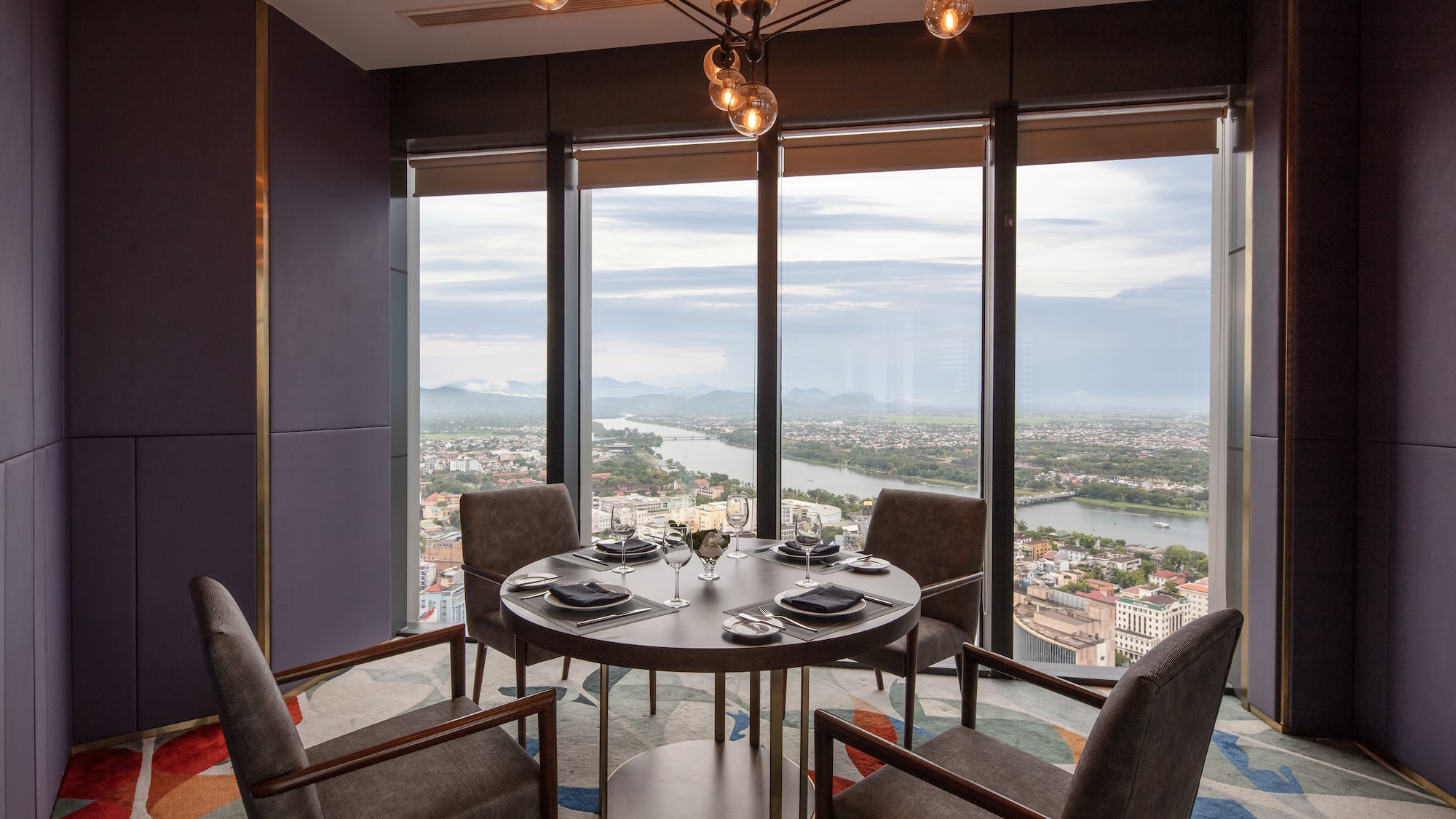 a dining room with a table and chairs