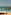 Private infinity pool overlooking the ocean, with sunbed and outdoor shower.