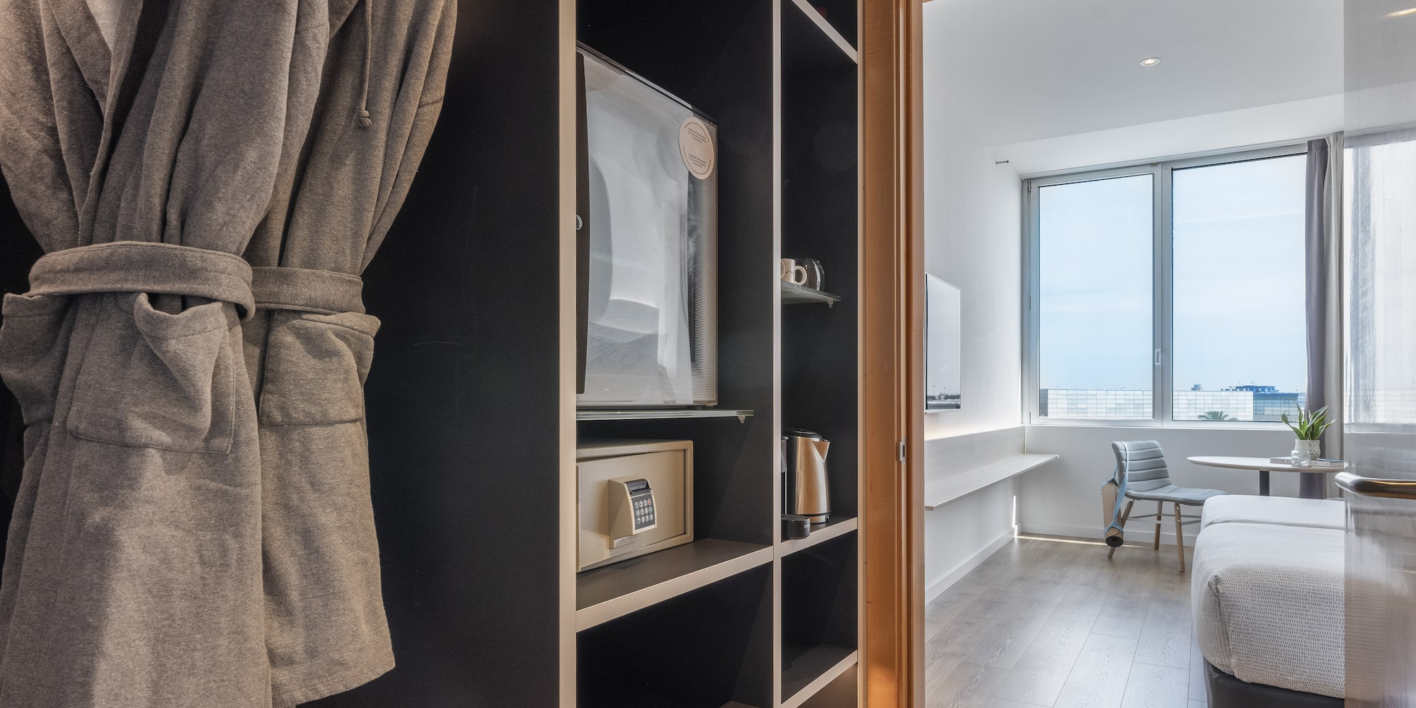 a room with a bed and a bathrobe