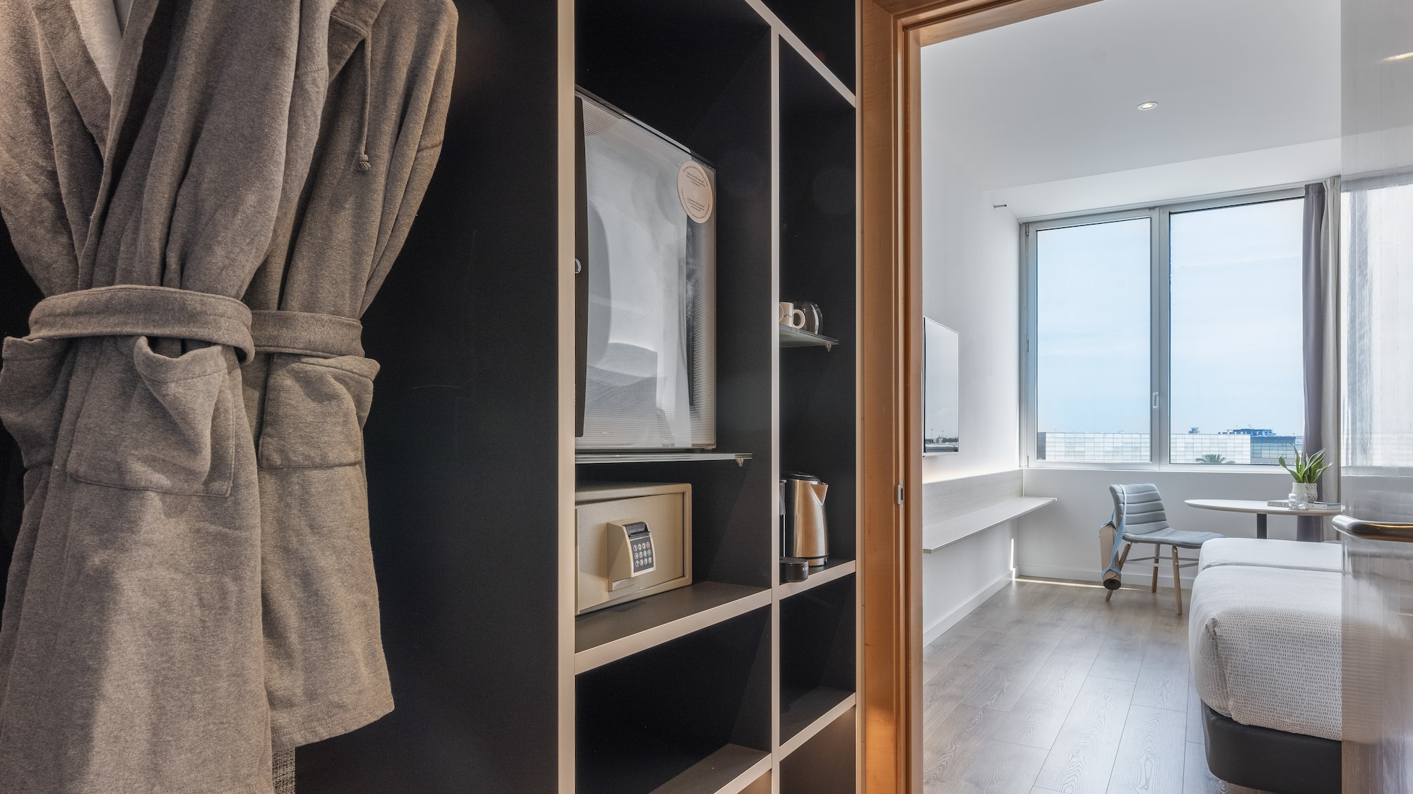 a room with a bed and a bathrobe