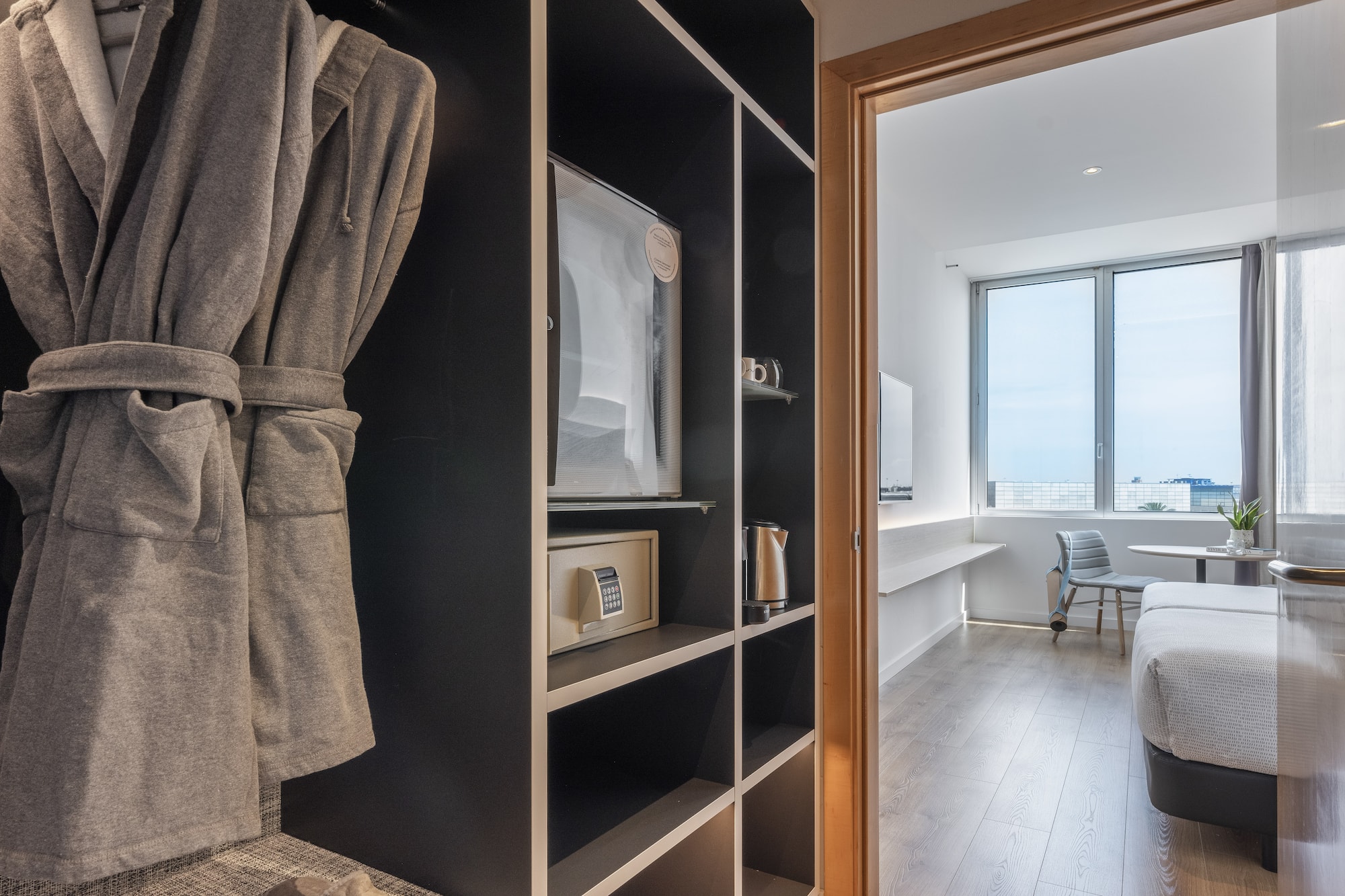 a room with a bed and a bathrobe