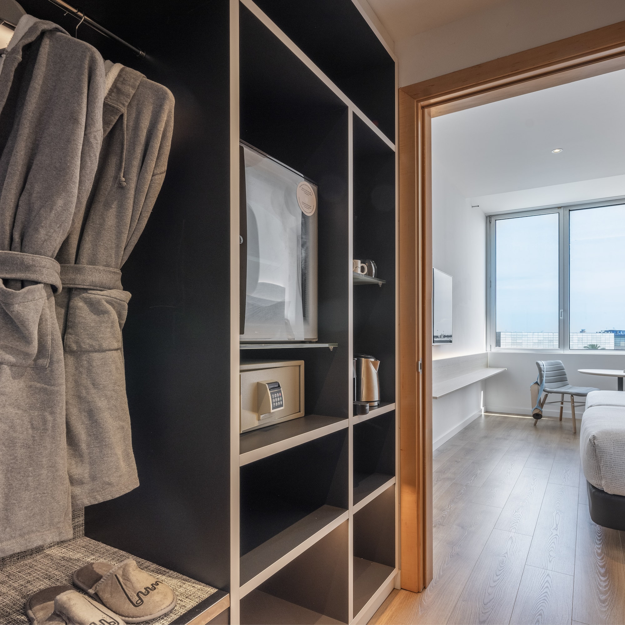 a room with a bed and a bathrobe