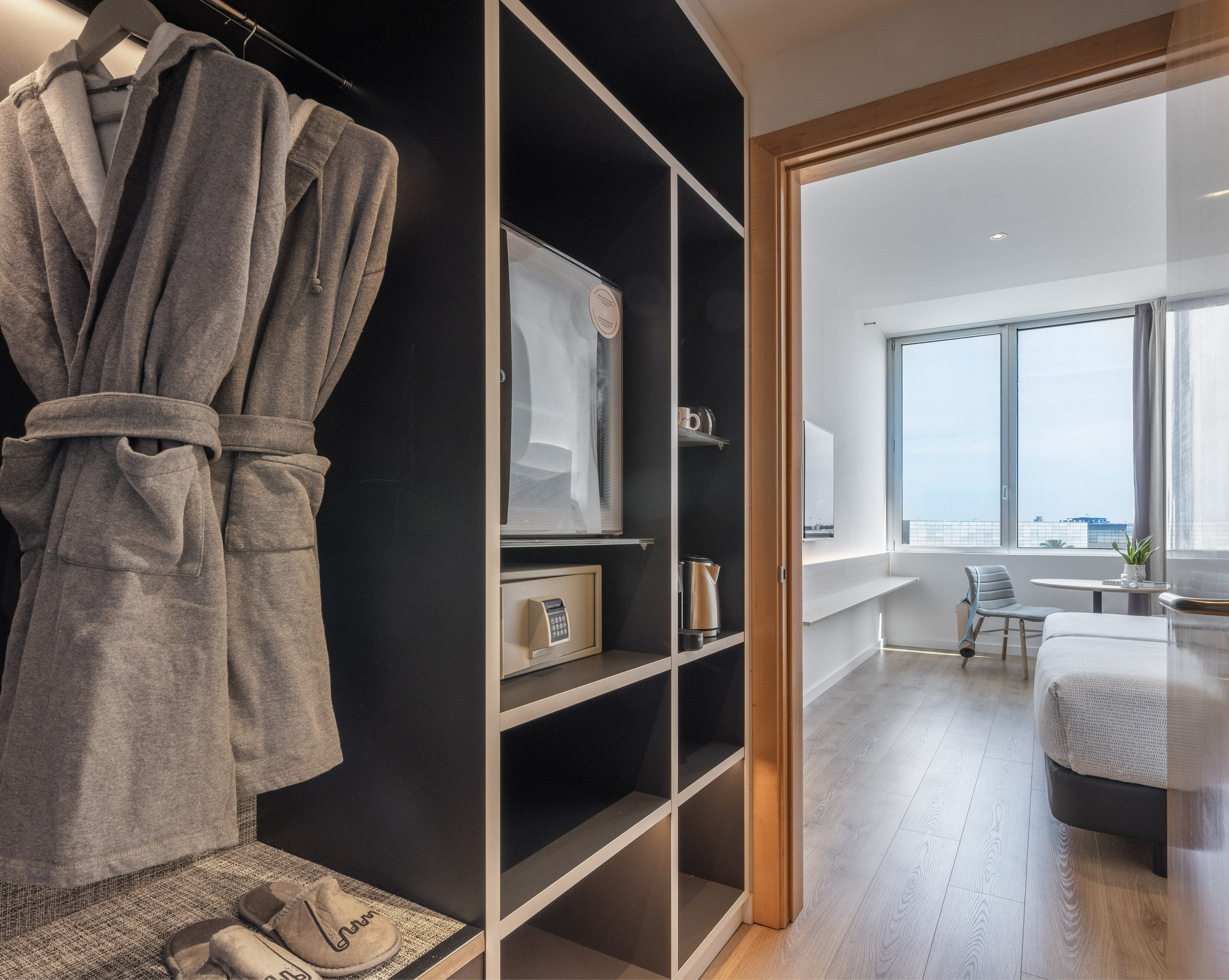 a room with two beds and a table