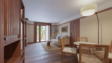 a living room with a couch and chairs
