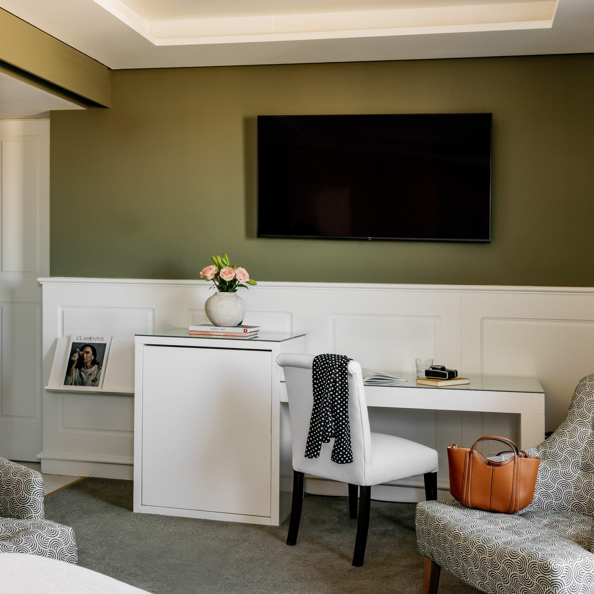 a room with a tv and chair