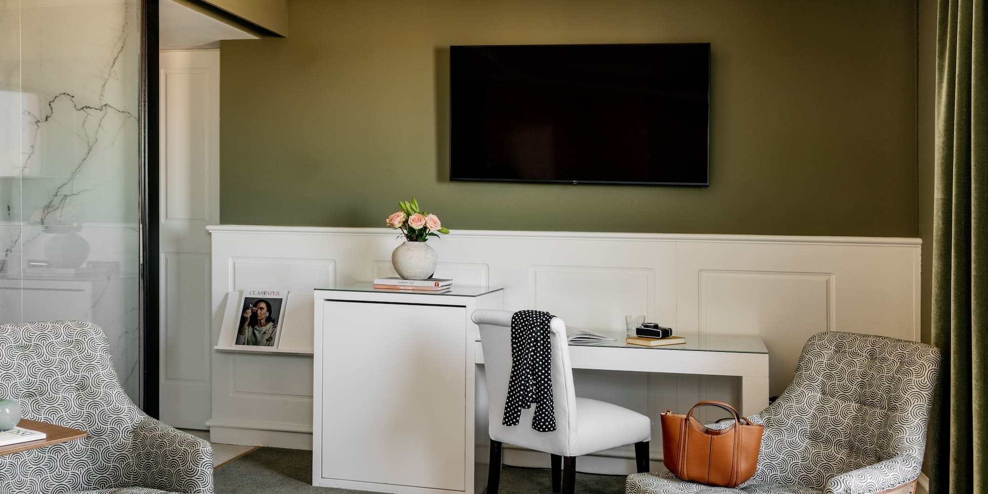 a room with a tv and chair