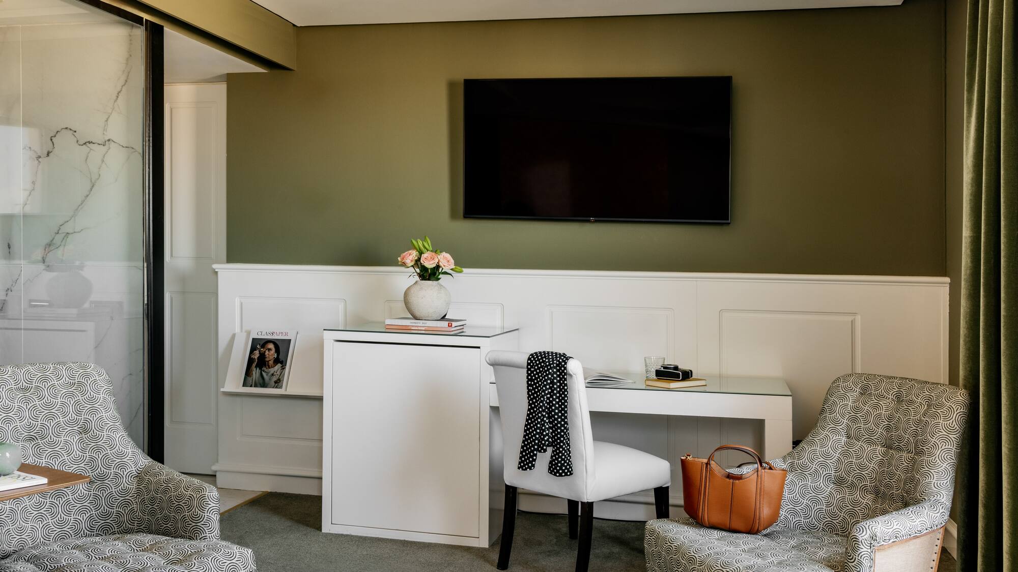 a room with a tv and chair