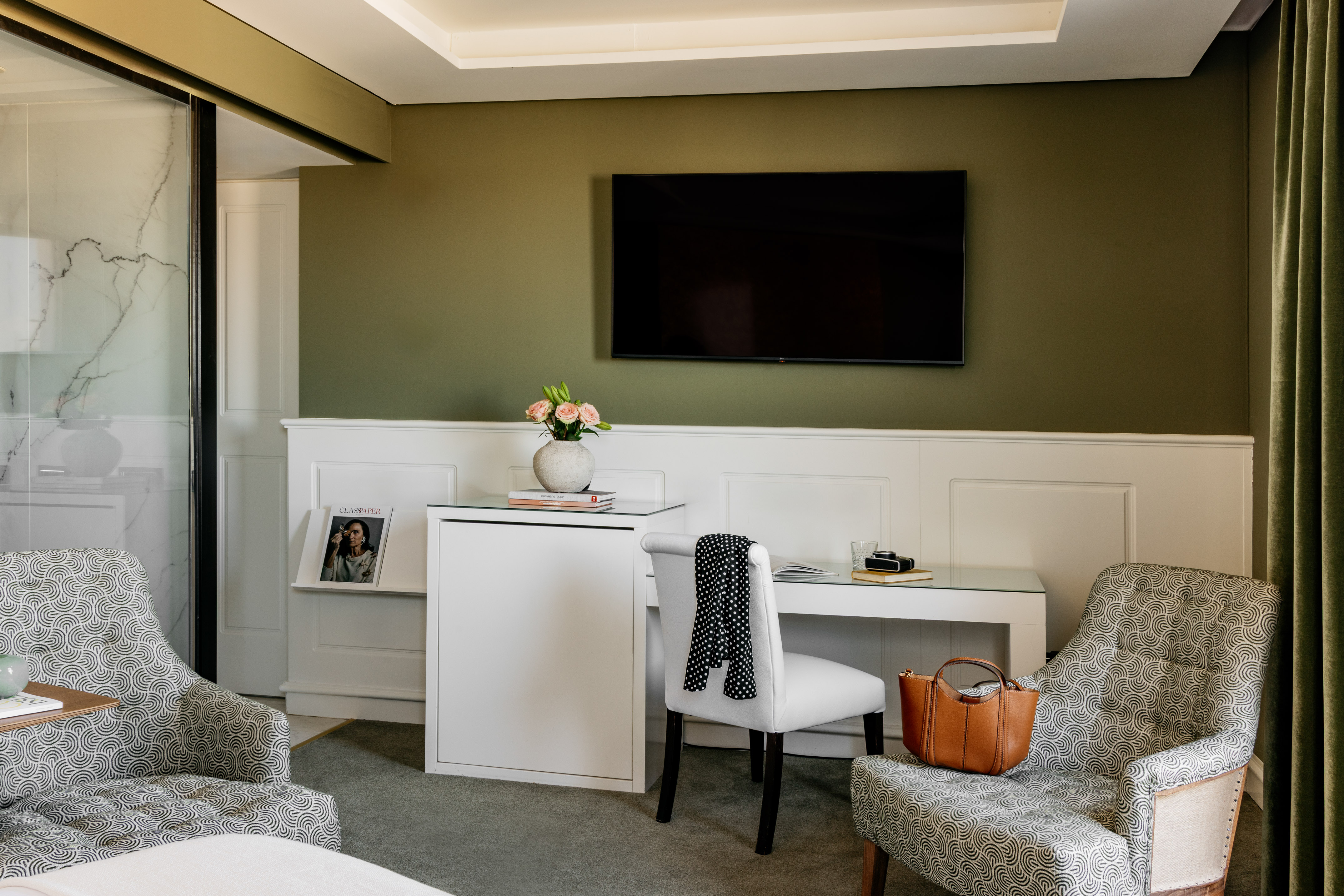 a room with a tv and chair