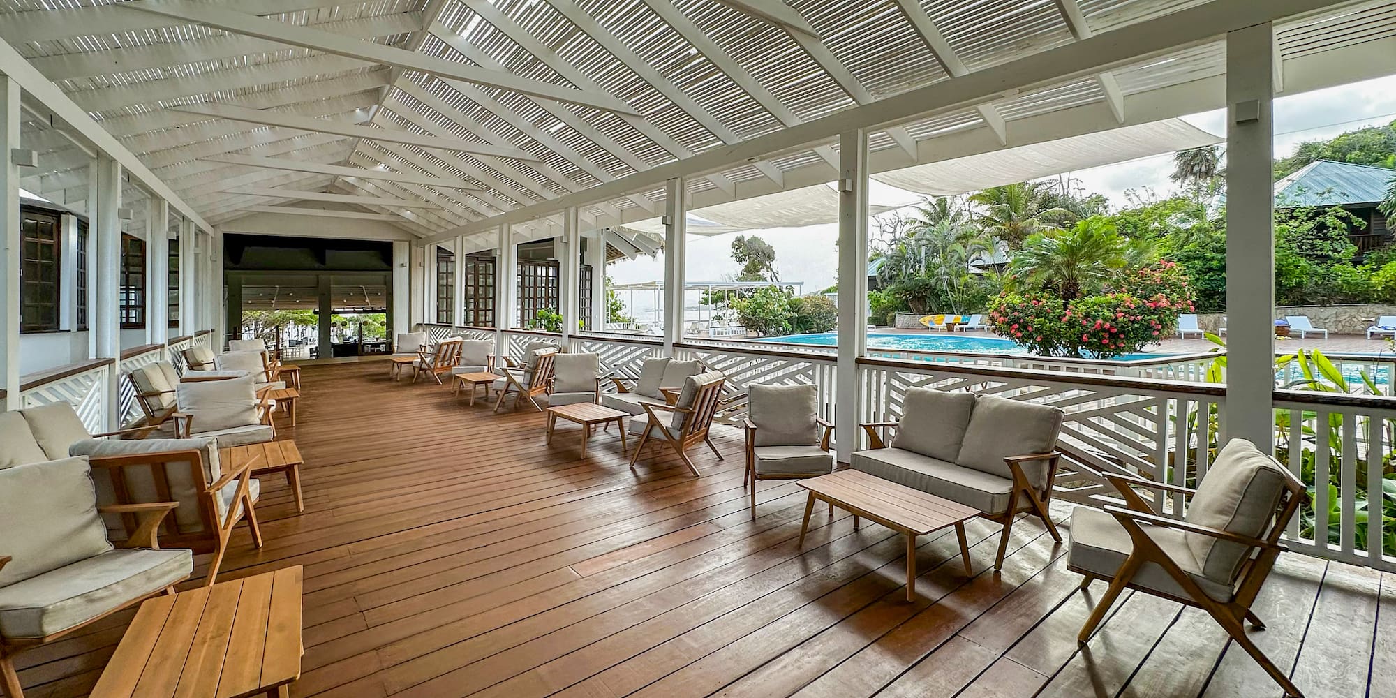 a patio with chairs and a pool