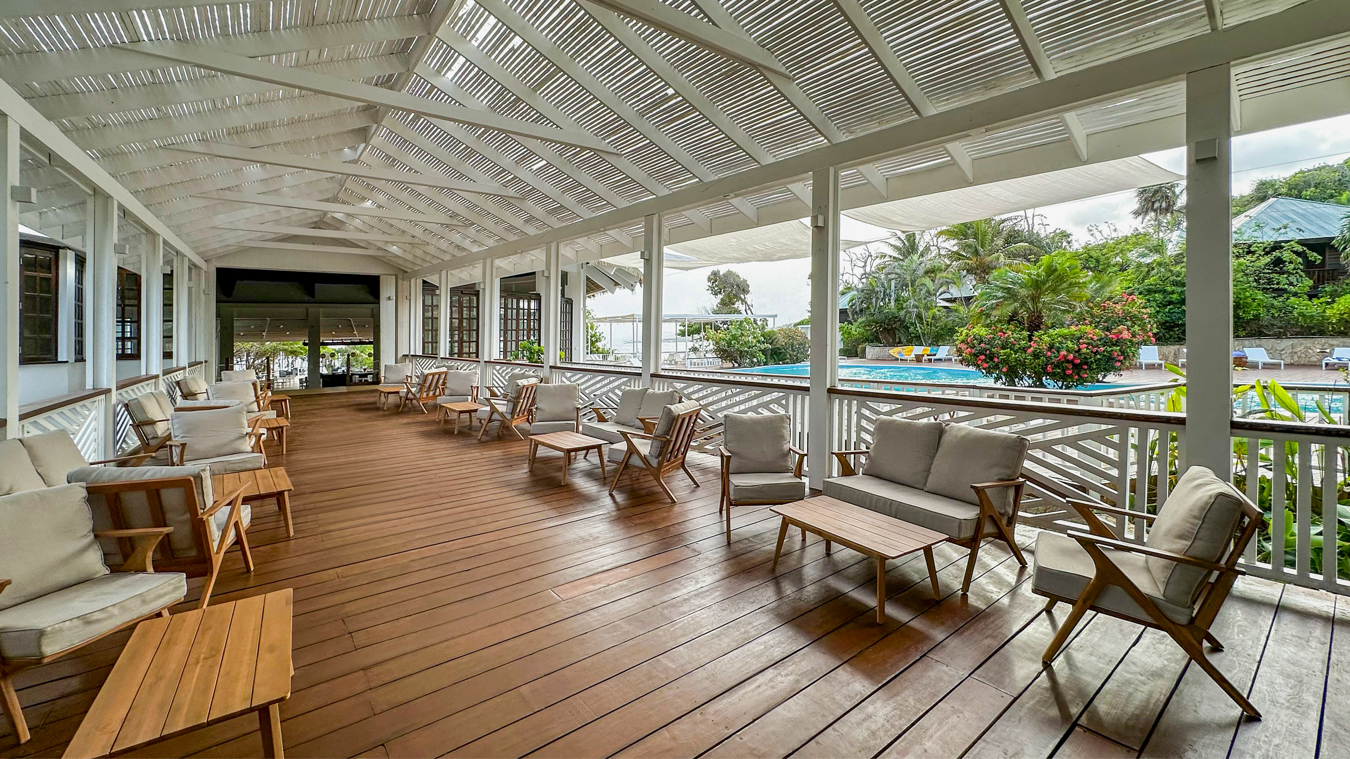 a patio with chairs and a pool