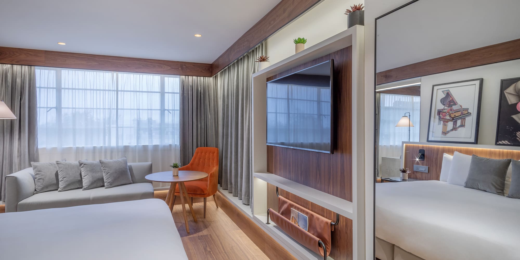 a room with a bed and a tv