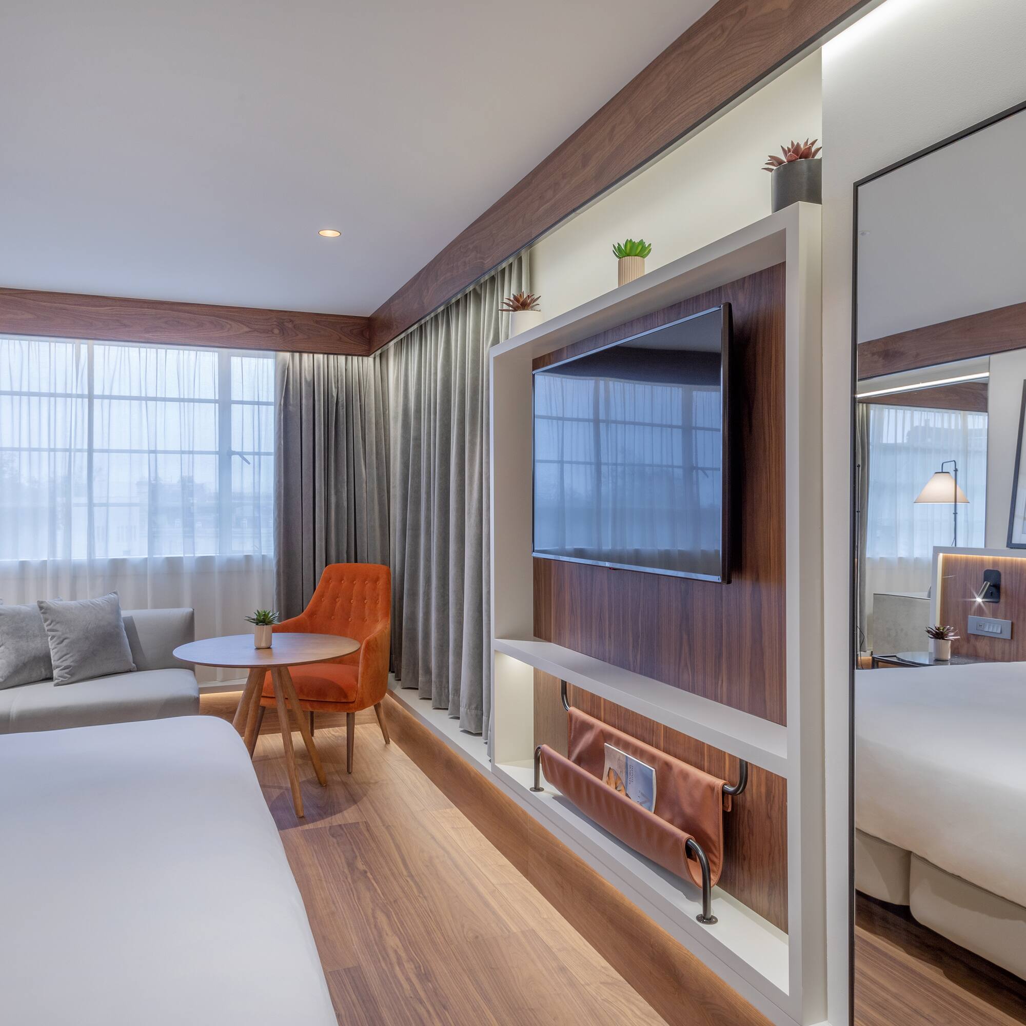 a room with a bed and a tv