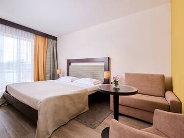 a room with a bed and a table