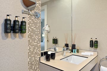 a bathroom with a mirror and sink